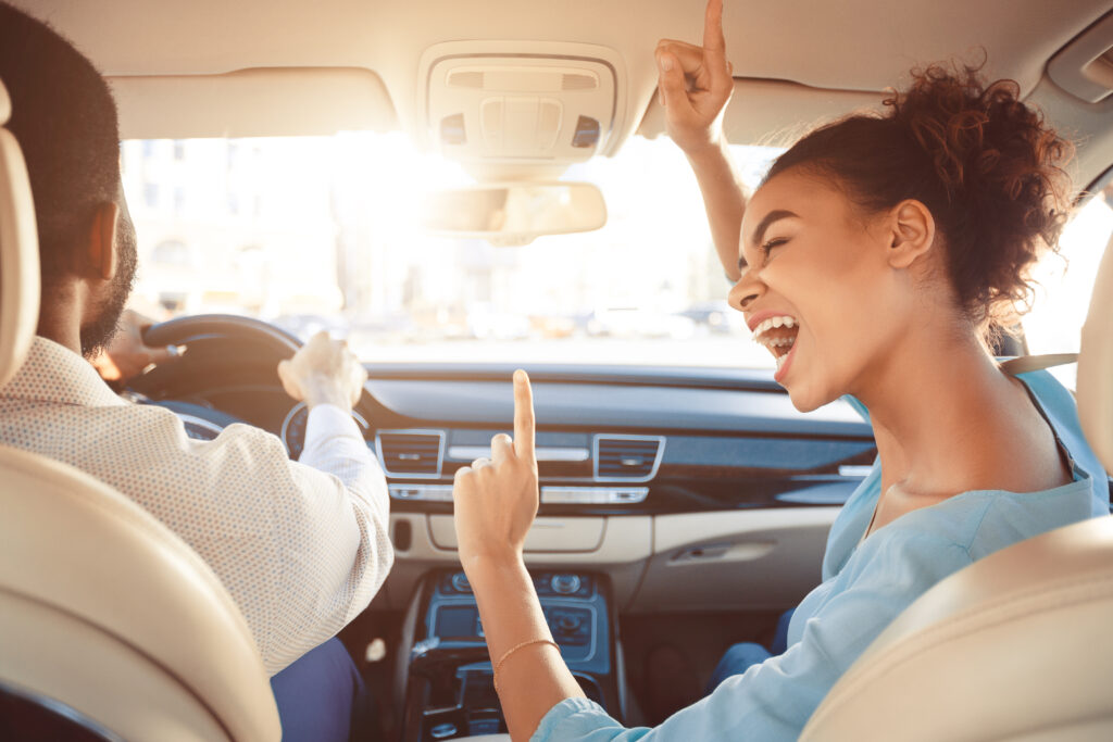 Two people enjoying car ride